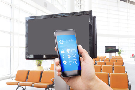 smart phone with smart home and modern airport hall