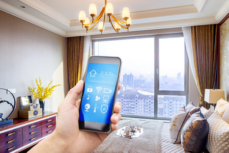 smart phone with smart home and modern bedroomのeditorial素材