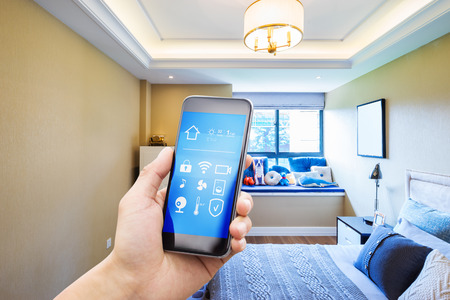smart phone with smart home and modern bedroomのeditorial素材