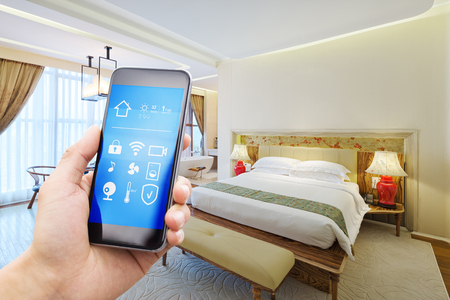 smart phone with smart home and modern bedroomのeditorial素材