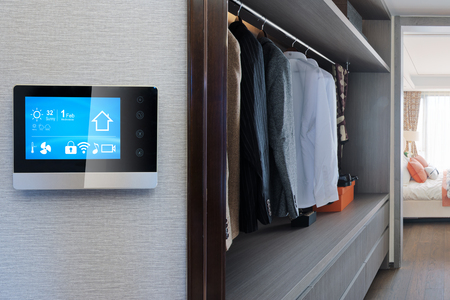 smart home system on intelligence screen on wall and background of modern wardrobeのeditorial素材