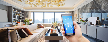smart home system on mobile phone with background of modern living roomのeditorial素材