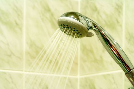 Stream water are poured from showerの写真素材