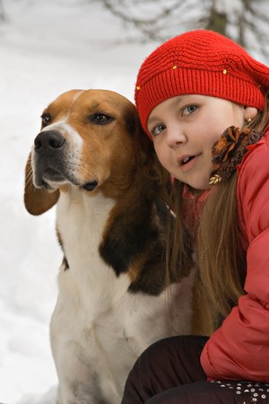 Girl with a dog in the foresの写真素材