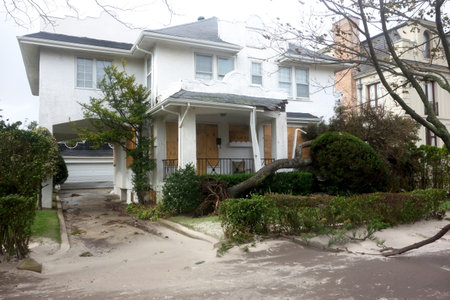 FAR ROCKAWAY, NY -OCTOBER 30: Fallen tree damaged house in the aftermath of Hurricane Sandy on...