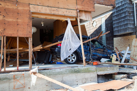 FAR ROCKAWAY, NY - NOVEMBER 11: Destroyed car in the aftermath of Hurricane Sandy on November 11, 2012 in Far Rockaway, NY  のeditorial素材