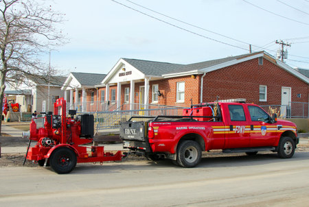 BREEZY POINT, NY - NOVEMBER 15: Fire department marine operations truck with water pump  moved to flooded area in the aftermath of Hurricane Sandy on November 15, 2012 in Breezy Point, NYのeditorial素材