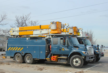 BREEZY POINT, NY - NOVEMBER 15: Canadian electrical company Hydro Quebec trucks helping to restore lost power in the aftermath of Hurricane Sandy on November 15, 2012 in Breezy Point, NYのeditorial素材