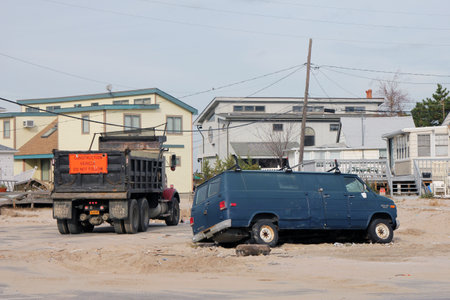 BREEZY POINT, NY - NOVEMBER 15: Destroyed van and construction truck  in the aftermath of Hurricane Sandy on November 15, 2012 in Breezy Point, Nのeditorial素材