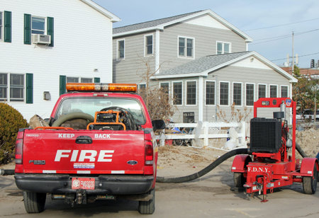 BREEZY POINT, NY - NOVEMBER 20: Fire department marine operations truck with water pump  moved to...