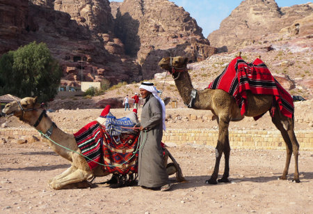 PETRA, JORDAN - NOVEMBER 16: Bedouin with camels on November 16, 2010 in Petra, Jordan.  Petra has been a UNESCO World Heritage Site since 1985のeditorial素材