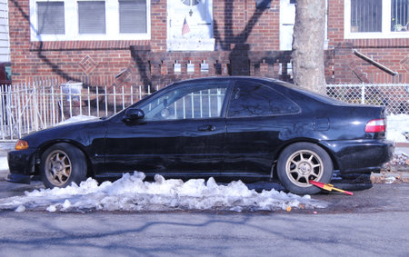 BROOKLYN,NEW YORK - FEBRUARY 14: Wheel lock on an illegally parked car in Brooklyn, NY on February 14, 2013. NYC started wheel lock program in January 2013.のeditorial素材