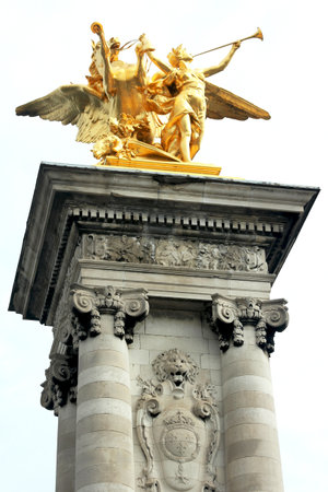 PARIS, FRANCE - AUGUST 21:Golden statue on Pont Alexandre III in Paris on August 21, 2011. The Pont Alexandre III is an arch bridge that spans the Seine and  classified as a historical monumentのeditorial素材