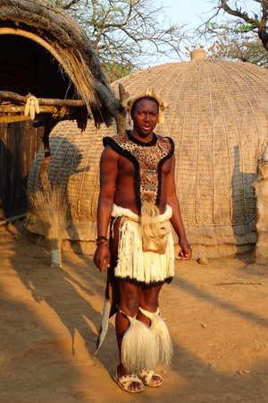 ZULULAND, SOUTH AFRICA - SEPTEMBER 14: Zulu warrior at the Great Kraal in Shakaland Zulu Village on...