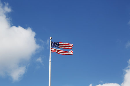 American flag damaged by superstorm flying high four months after Hurricane Sandy on February, 28, 2013 in Brooklyn, New York  のeditorial素材