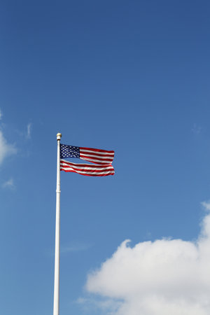 American flag damaged by superstorm flying high four months after Hurricane Sandy on February, 28, 2013 in Brooklyn, New York   のeditorial素材