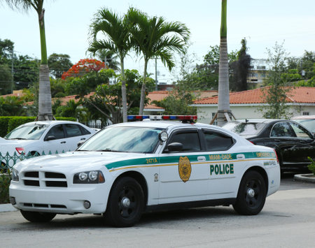 MIAMI, FLORIDA- JUNE 13 :Miami - Dade police department car in South Miami  on June 13, 2013.  Police Department serving Miami-Dade County and has more than 3 thousand officersのeditorial素材