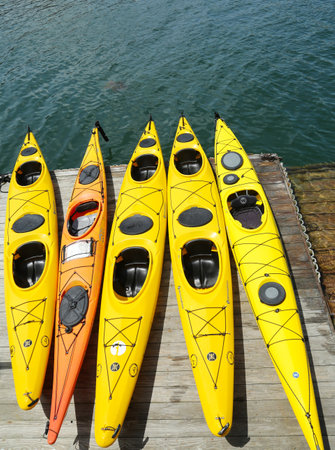 BAR HARBOR, MAINE - JULY 6: Sea kayaks ready for tourists in Bar Harbor on July 6, 2013. Bar Harbor is a famous summer colony in the Down East region of Maine のeditorial素材