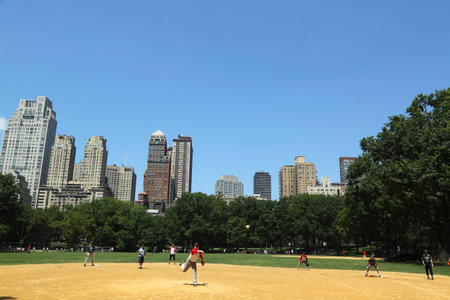 NEW YORK CITY - JULY 18:Softball teams playing at Heckscher Ballfields in Central Park on July 18,...