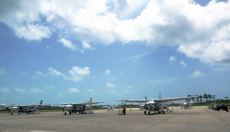 BELIZE CITY - JUNE 9 Short range planes ready for passengers at Philip S  W  Goldson Airport in...