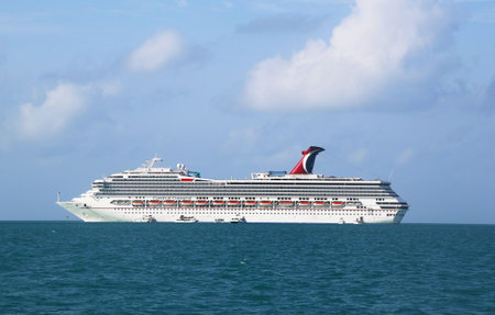 BELIZE- JUNE 13  Carnival Conquest Cruise Ship anchors near Belize City and ready to tender visitors to the port on June 13, 2013  Carnival Conquest has capacity of 2974 passengers and crew of 1150 のeditorial素材