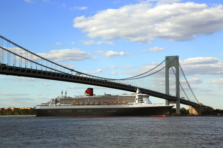 NEW YORK CITY - AUGUST 15  Queen Mary 2 cruise ship in New York Harbor under Verrazano Bridge heading for Transatlantic Crossing from New York to Southampton on August 15, 2013 のeditorial素材