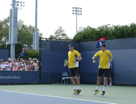 FLUSHING, NY - AUGUST 29 Grand Slam champions Mike and Bob Bryan during first round doubles match at US Open 2013 against Federico Delbonis and Leonardo Mayer on August 29, 2013 in Flushing, NYのeditorial素材