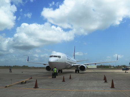 BELIZE CITY - JUNE 9  United airline plane landed at Philip S W Goldson Airport in Belize on June 9, 2013 Belize is a country located on the northeastern coast of Central America のeditorial素材
