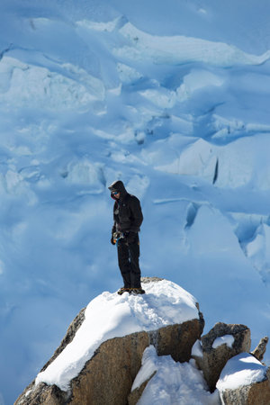 AUGUILLE DU MIDI, FRANCE -OCTOBER 9 Unidentified climbers instructor at the mountain top station of the Aiguille du Midi 3842 m in French Alps on October 9, 2013  Mont Blanc mountain at the backgroundのeditorial素材
