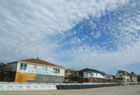 FAR ROCKAWAY, NY - OCTOBER 22  Damaged beach houses in devastated area one year after Hurricane Sandy on October 22, 2013 in Far Rockaway, NY  Notice protective barrier build to prevent flooding のeditorial素材
