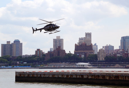 NEW YORK - AUGUST 17  Helicopter an the Downtown Manhattan heliport on August 17, 2013  It is a helicopter landing platform at Pier 6 in the East River in Manhattanのeditorial素材