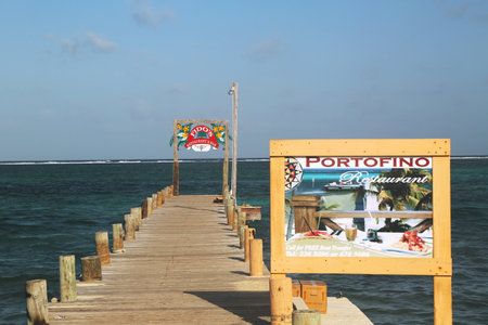 SAN PEDRO, BELIZE - JUNE 10  Wooden dock at the waterfront in San Pedro on June 10, 2013  San Pedro is a popular tourist destination at the island of Ambergris Caye in Belize のeditorial素材
