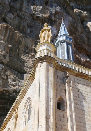 Notre Dame statue on top of the Notre Dame de Rocamadour chapel in Episcopal City of Rocamadour, France Wooden Black Madonna is housed inside the Chapelle de Notre-Dameの写真素材