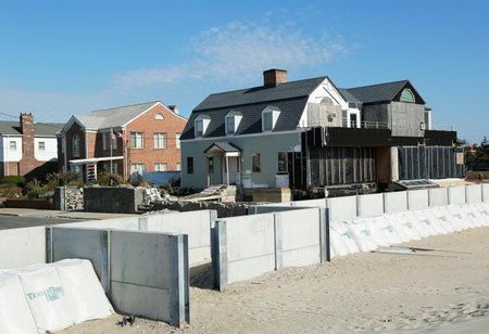 FAR ROCKAWAY, NY - OCTOBER 22  Damaged beach house in devastated area one year after Hurricane Sandy on October 22, 2013 in Far Rockaway, NY  Notice protective barrier build to prevent flooding のeditorial素材