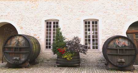 BURGUNDY, FRANCE -OCTOBER 6 An old painted wine barrels in Chateau de Pommard on October 6, 2013 Chateau de Pommard is a 18th century castle famous for winery with 20 hectares vineyard and art galleryのeditorial素材