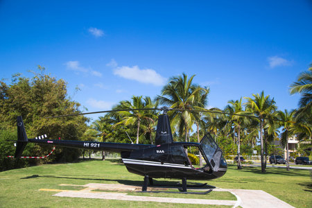 PUNTA CANA, DOMINICAN REPUBLIC - DECEMBER 31  The Robinson R44 Helicopter from Cana Fly in Punta Cana on December 31, 2013  The Robinson R44 is a four-seat light  utility and trainer helicopterのeditorial素材