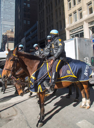 NEW YORK - JANUARY 30  NYPD police officers on horseback ready to protect public on Broadway during Super Bowl XLVIII week in Manhattan on January 30, 2014 のeditorial素材