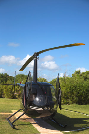 PUNTA CANA, DOMINICAN REPUBLIC - DECEMBER 31 The Robinson R44 Helicopter from Cana Fly in Punta Cana on December 31, 2013 The Robinson R44 is a four-seat light utility and trainer helicopter のeditorial素材
