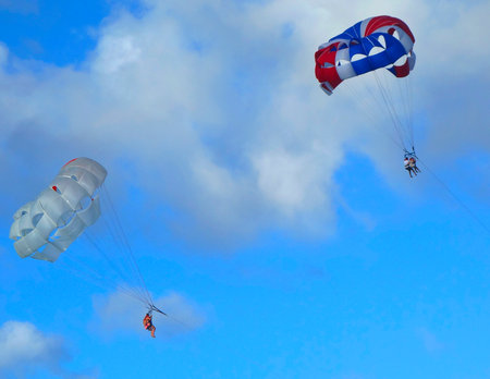 PUNTA CANA, DOMINICAN REPUBLIC - DECEMBER 30  Parasailing in a blue sky in Punta Cana on December 30, 2013  Parasailing is a popular recreational activity among tourists in Dominican Republic                                       のeditorial素材