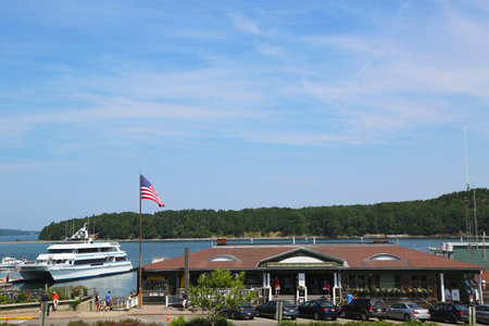 BAR HARBOR, MAINE - JULY 7  Bar Harbor Town Pier with whale watching boat in historic Bar Harbor on July 7, 2013  Bar Harbor is a famous summer colony in the Down East region of Maine のeditorial素材