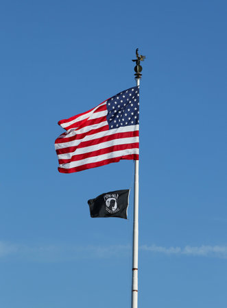 BROOKLYN, NY - AUGUST 23   American and POW  MIA flags in Brooklyn on August 23, 2013  The POW MIA flag is a symbol of US military personnel taken as prisoners of war or listed as missing in action のeditorial素材
