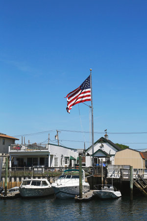 FREEPORT, NEW YORK - MAY 29  American flag flying in Freeport, Long Island on May 29, 2014
