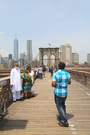 NEW YORK - JUNE 17  Tourists taking pictures on the  Brooklyn Bridge on June 17, 2014 The Brooklyn...