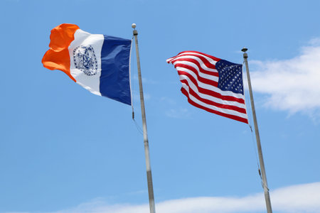 NEW YORK - JUNE 24  American and  New York City flags in New York on June 24, 2014