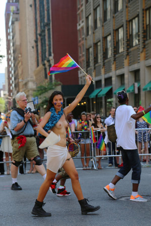 NEW YORK - June 29, 2014  Topless LGBT Pride Parade participant in New York City on June 29, 2014  LGBT pride march takes place during pride week and is the culmination of week long festivitiesのeditorial素材