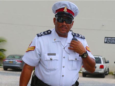 GEORGE TOWN, GRAND CAYMAN - JUNE 12  Senior constable from Royal Cayman Islands Police Service in George Town on June 12, 2014  のeditorial素材