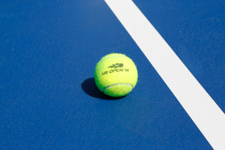 NEW YORK - AUGUST 19  Wilson tennis ball on tennis court at Arthur Ashe Stadium on August 19, 2014 in New York  Wilson is the Official Ball of the US Open since 1979のeditorial素材