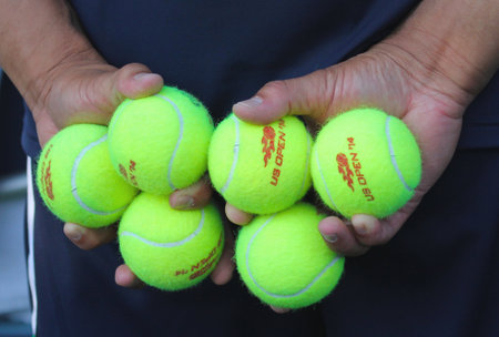 NEW YORK - AUGUST 19  Ball boy holding tennis balls at the Billie Jean King National Tennis Center on August 19, 2014 in New York  US Open 2014 qualifying matches started on August 19, 2014のeditorial素材