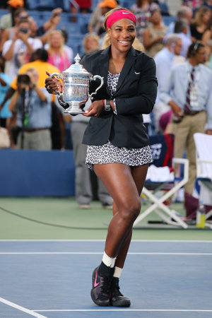 NEW YORK  - SEPTEMBER 7 Eighteen times Grand Slam champion and US Open 2014 champion Serena Williams holding US Open trophy during trophy presentation on September 7, 2014 in New Yorkのeditorial素材
