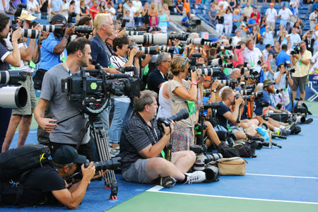 NEW YORK- SEPTEMBER 7 Professional photographers on tennis court during trophy presentation at the Arthur Ashe Stadium at Billie Jean King National Tennis Center on September 7, 2014 in New Yorkのeditorial素材